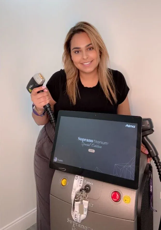 Dina Ben Barouch, founder of Lotus, beside the Soprano Titanium laser console